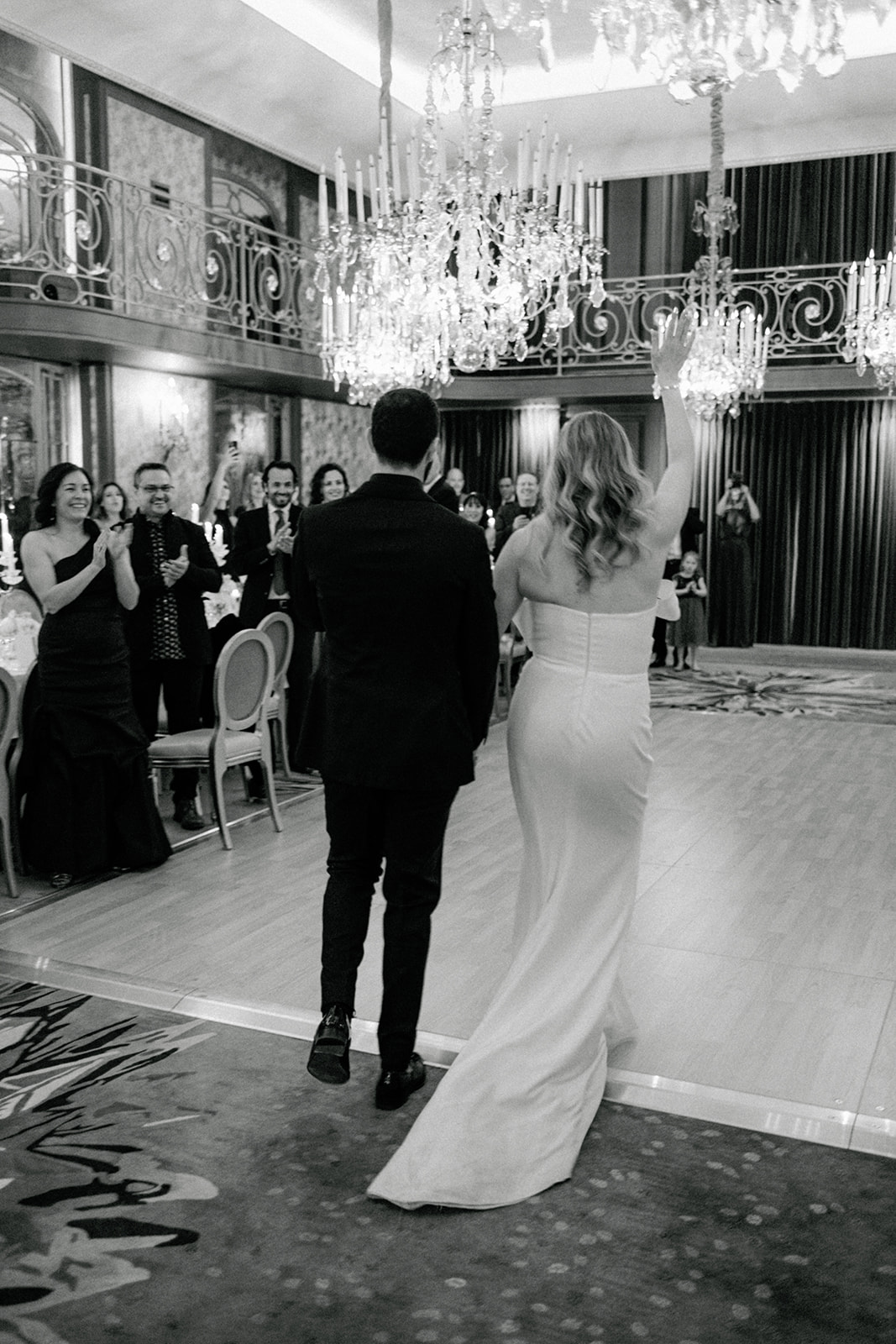 Newlyweds entering their wedding reception room at Hôtel Plaza Athénée